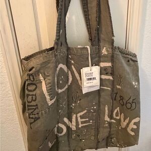 Magnolia Pearl Olive Green Canvas Tote with Cream and Black Lettering.